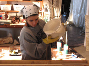 Maressa pouring rubber for a rubber mold